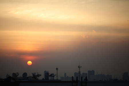The Sun With satellite dish and urban の写真素材