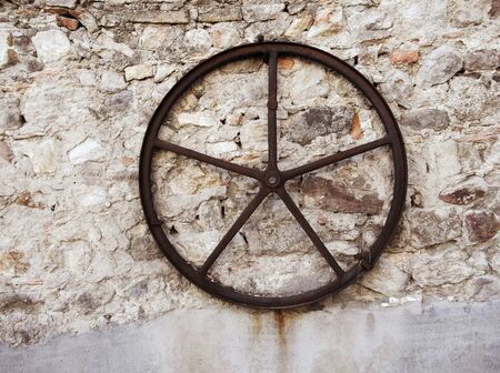 Old iron wheelの写真素材
