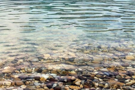 Pebbles in the clear water, の写真素材