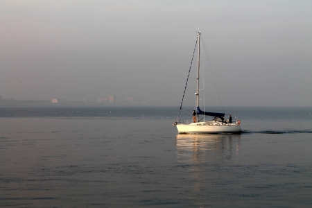 yacht returns from the sea to the portの写真素材