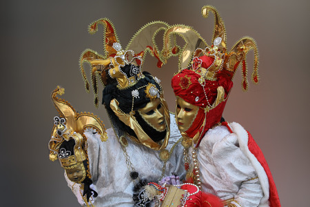 Traditionally dressed Venice carnival person in Piazza San Marco, Italyの写真素材