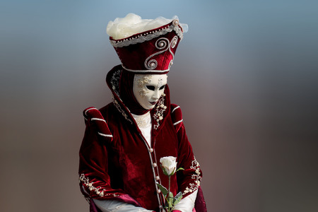 Traditionally dressed Venice carnival person in Piazza San Marco, Italyの写真素材