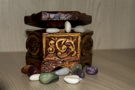 wooden casket with precious stones , close upの写真素材