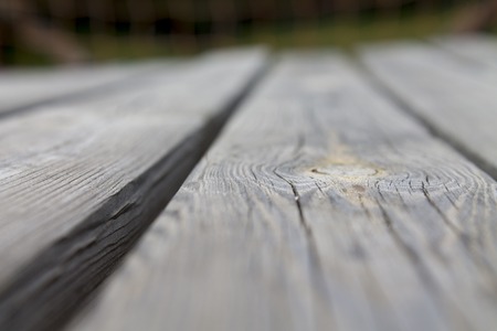Wooden board in front of blurred background