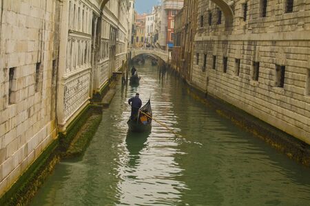 Beautiful scene with traditional gondola and canal in Venice, Italyの写真素材