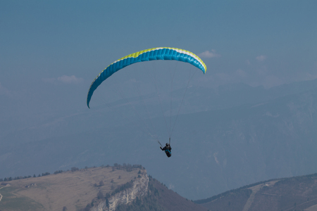 Wingsuit, Mount Baldo, Veneto Italy ,Skydiver in flight against the backdrop of the mountainの写真素材