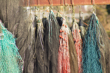Fishing nets with floats on the waterfrontの写真素材