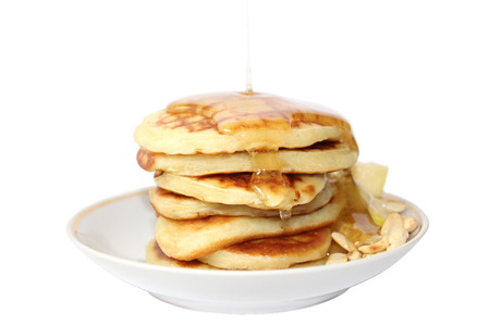 A pancake is a flat cake, often thin, and round, prepared from a starch-based batter that may also contain eggs, milk and butter and cooked on a hot surface such as a griddle or frying pan, often with oil or butter. They may be served at any time with a vの写真素材