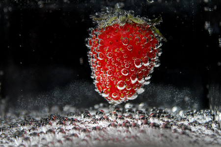 Fresh fruit in water with bubbles.の写真素材