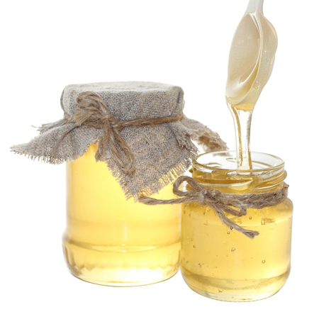 Honey is a sweet food made by bees foraging nectar from flowers. The variety produced by honey bees is the one most commonly referred to, as it is the type of honey collected by most beekeepers and consumed by people.の写真素材