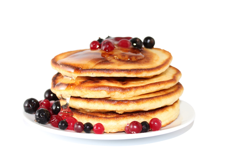 A pancake is a flat cake, often thin, and round, prepared from a starch-based batter that may also contain eggs, milk and butter and cooked on a hot surface such as a griddle or frying pan, often with oil or butter. They may be served at any time with a vの写真素材