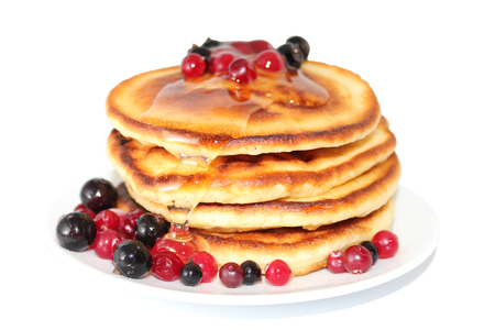 A pancake is a flat cake, often thin, and round, prepared from a starch-based batter that may also contain eggs, milk and butter and cooked on a hot surface such as a griddle or frying pan, often with oil or butter. They may be served at any time with a vの写真素材