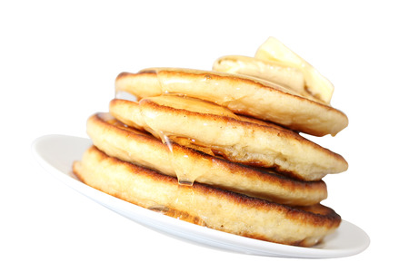 A pancake is a flat cake, often thin, and round, prepared from a starch-based batter that may also contain eggs, milk and butter and cooked on a hot surface such as a griddle or frying pan, often with oil or butter. They may be served at any time with a vの写真素材