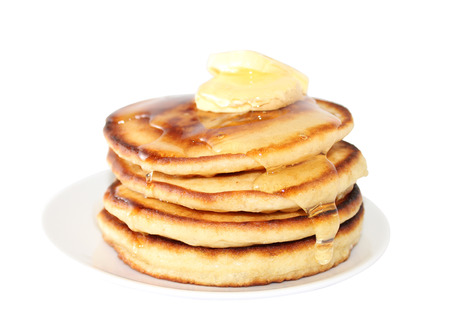 A pancake is a flat cake, often thin, and round, prepared from a starch-based batter that may also contain eggs, milk and butter and cooked on a hot surface such as a griddle or frying pan, often with oil or butter. They may be served at any time with a vの写真素材