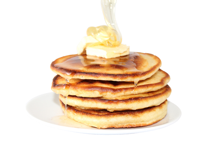 A pancake is a flat cake, often thin, and round, prepared from a starch-based batter that may also contain eggs, milk and butter and cooked on a hot surface such as a griddle or frying pan, often with oil or butter. They may be served at any time with a vの写真素材