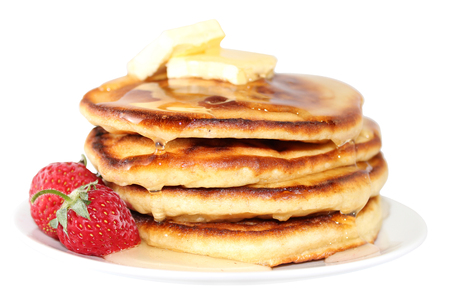A pancake is a flat cake, often thin, and round, prepared from a starch-based batter that may also contain eggs, milk and butter and cooked on a hot surface such as a griddle or frying pan, often with oil or butter. They may be served at any time with a vの写真素材