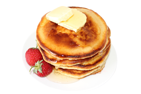 A pancake is a flat cake, often thin, and round, prepared from a starch-based batter that may also contain eggs, milk and butter and cooked on a hot surface such as a griddle or frying pan, often with oil or butter. They may be served at any time with a vの写真素材