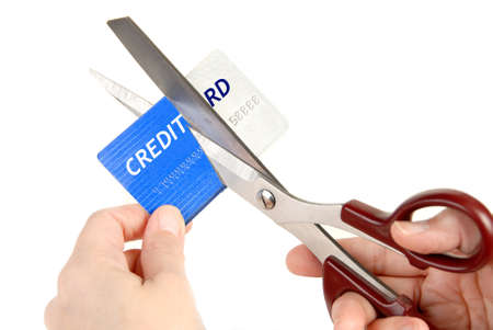 Cutting up a credit card with scissors