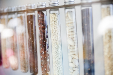 A row of cooking ingredients in test tubesの写真素材