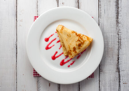 light summer breakfast with hot pancake and raspberry jamの写真素材