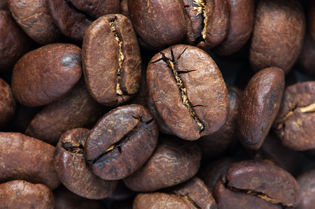 close up background of big roasted coffee beans fill the frameの写真素材