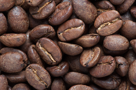 background of big roasted coffee beans fill the frameの写真素材