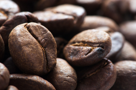close up background of big roasted coffee beans fill the frameの写真素材