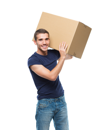 young man holding parcel on his shoulder and smilingの写真素材