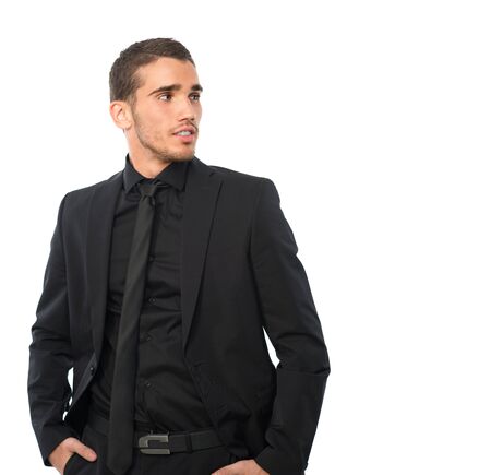 young man in black siut looking asideの写真素材