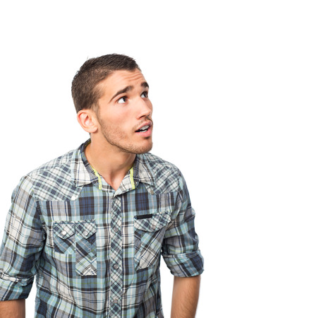 young man surpriced looking upの写真素材