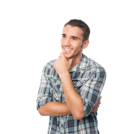 young man smile and looking acide and thinking about somethingの写真素材