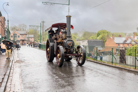Dudley, West Midlands-united kingdom July 13 2019 steam traction engine traveling along a main street on a rainy wet overcast day 1940's conceptのeditorial素材