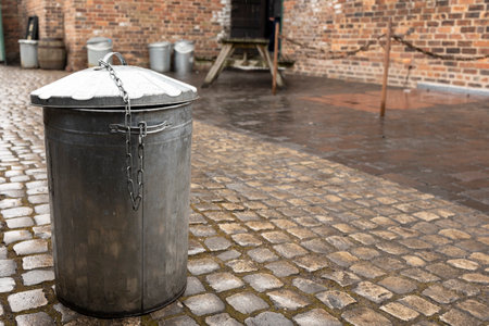 Trash can on a cobblestone street in Gdansk, Polandの写真素材