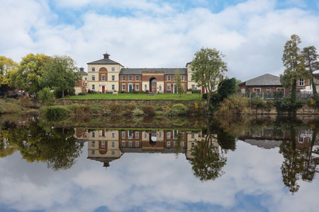 reflected river side property along the river seven in shrewsbury shropshireの写真素材