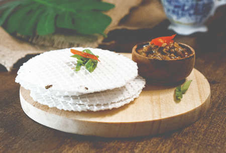 simpring, indonesian sundanese traditional meal. salty cracker with chili sauceの写真素材