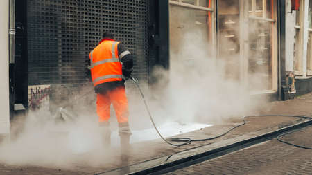 The worker in the morning cleans the walls in Amsterdam. The Netherlands, May 2017.の写真素材