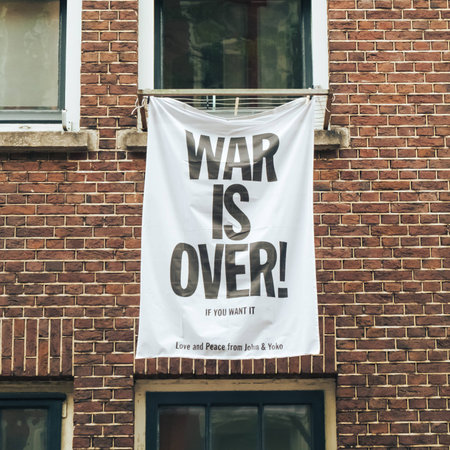 "The war is over, if you want it," the banner on the wall of the house in Amsterdam. May 2017.の写真素材
