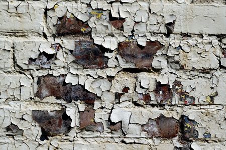 Close-Up of  Brick Wall With Peeling Paint