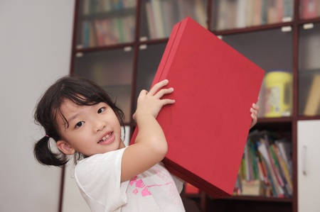 Happy asian kid with her gift box