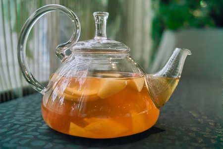 Tea pot on the table in the restaurantの写真素材