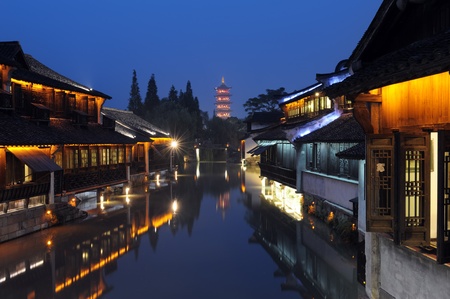 Night scene of traditional building near the river in Wuzhen town, Zhejiang province, Chinaの写真素材