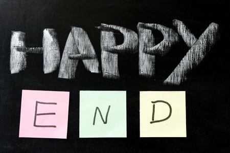 Chalk drawing - "Happy end" written on chalkboardの写真素材