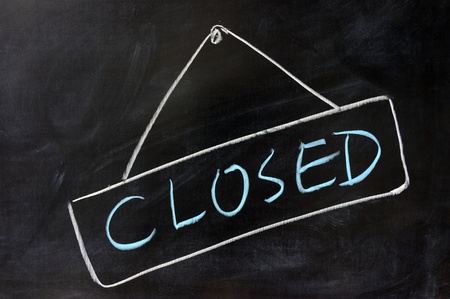 Chalk drawing - 'Closed' word written on chalkboardの写真素材