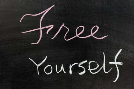 Conceptional chalk drawing - Free yourselfの写真素材