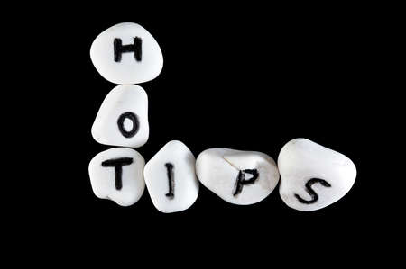 Hot tips words carved on group of stones