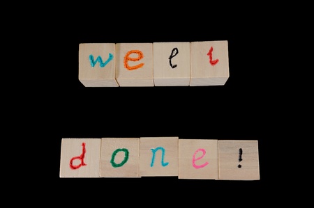 Well done words on group of wooden cubesの写真素材