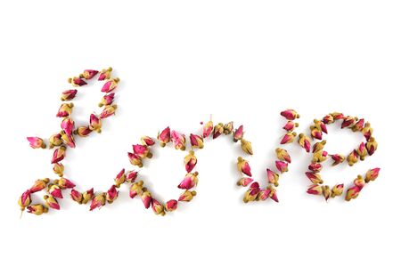 Love word made of dried flowers on white backgroundの写真素材