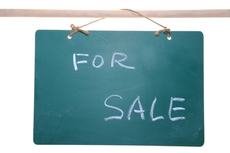 For sale sign on chalkboard isolated on white backgroundの写真素材
