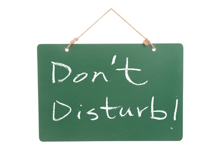 Don't disturb words written on green boardの写真素材