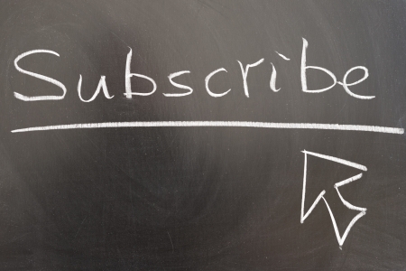 Subscribe and mouse pointer drawn on chalkboardの写真素材
